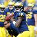 Michigan junior quarterback Denard Robinson looks to throw the ball during warm up before the start of their home game against Eastern Michigan at Michigan Stadium on Saturday. Melanie Maxwell I AnnArbor.com